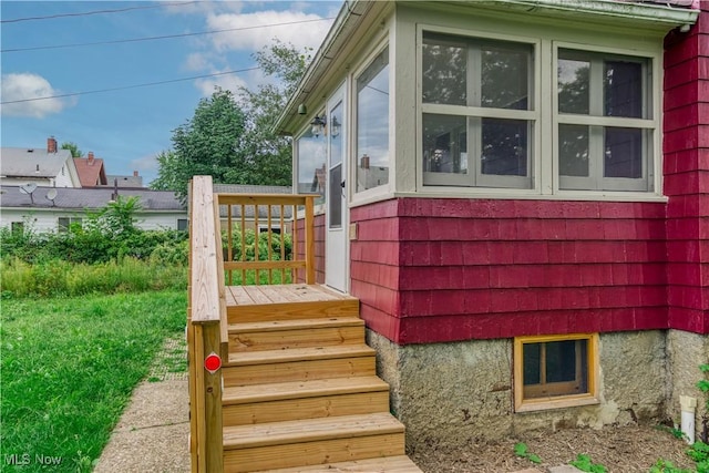 view of side of property featuring a sunroom