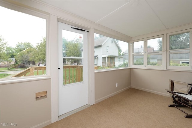 unfurnished sunroom with plenty of natural light