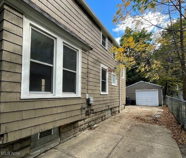 view of home's exterior featuring a garage and an outdoor structure