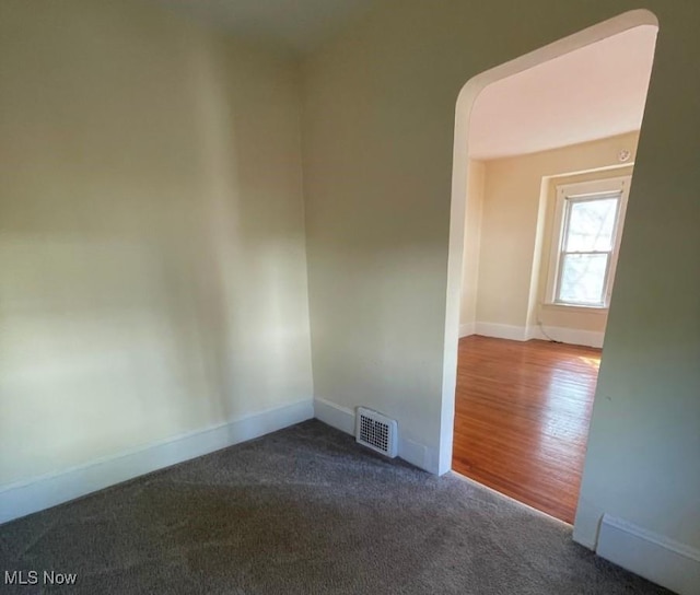 empty room featuring carpet flooring