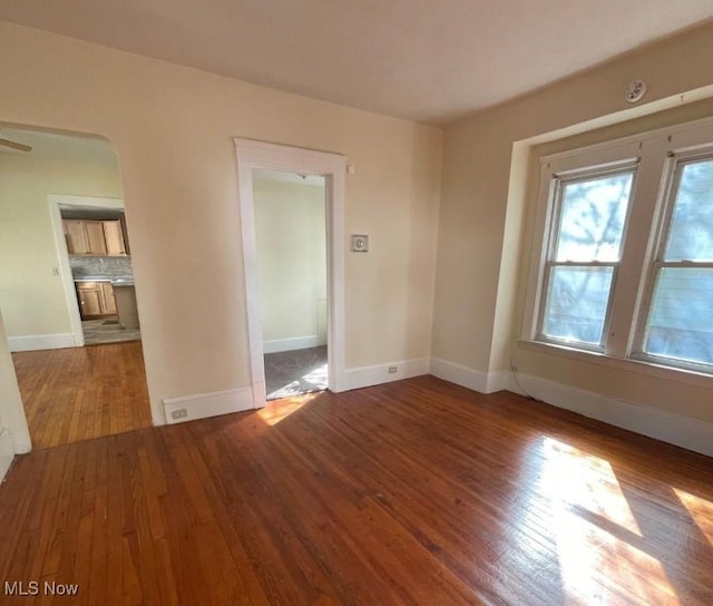 spare room with hardwood / wood-style floors