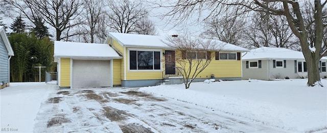 single story home featuring a garage