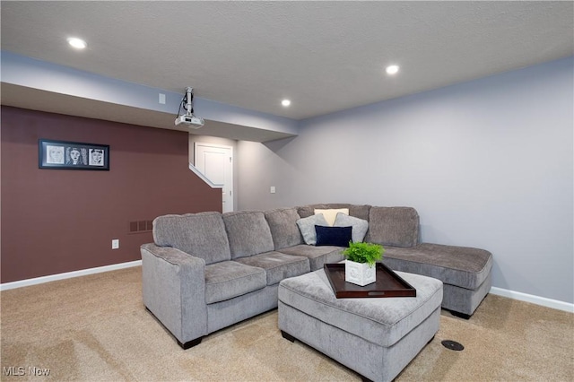 carpeted living room with a textured ceiling