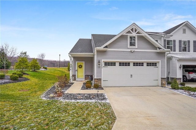 craftsman-style house with a garage and a front lawn