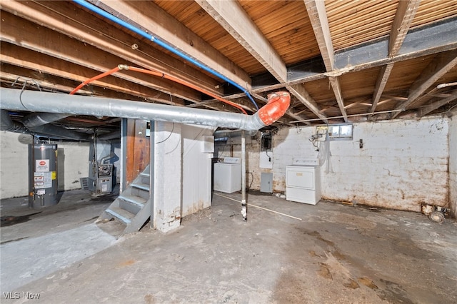 basement featuring washer / clothes dryer and water heater