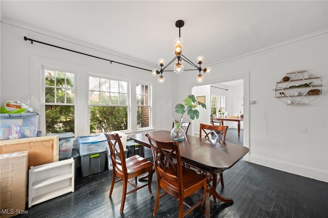 dining space with a chandelier, crown molding, and dark wood-type flooring