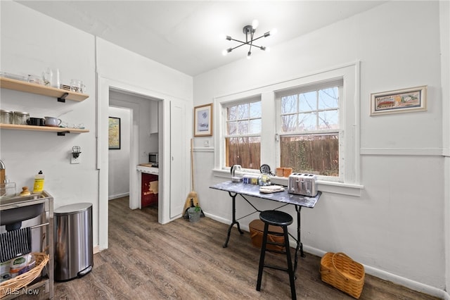 office area featuring dark hardwood / wood-style flooring and a notable chandelier