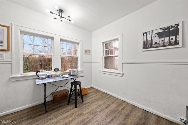 office area featuring a chandelier and wood-type flooring