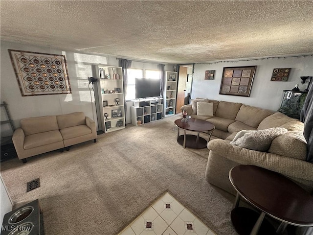 living room featuring carpet floors and a textured ceiling