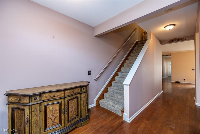 stairway featuring hardwood / wood-style flooring