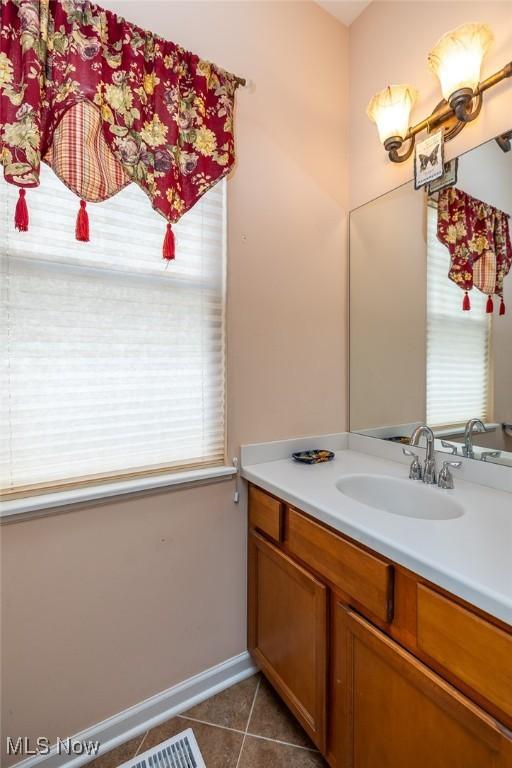 bathroom with vanity and tile patterned floors