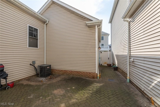 view of property exterior with central AC unit