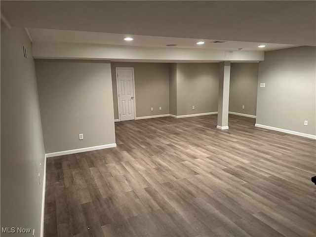 basement featuring wood-type flooring