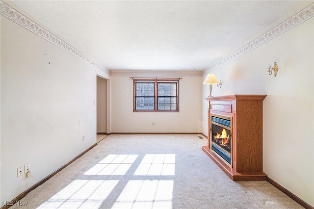 unfurnished living room featuring light colored carpet and crown molding