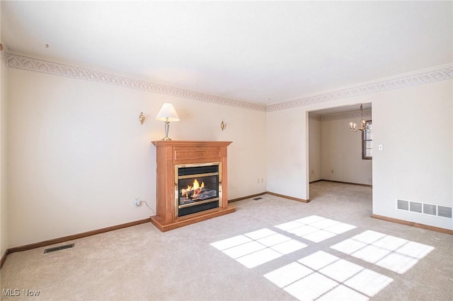 unfurnished living room with light colored carpet and a notable chandelier