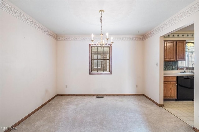 unfurnished dining area featuring light colored carpet, sink, and an inviting chandelier