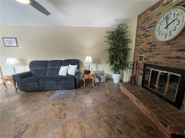 living room with a fireplace and ceiling fan