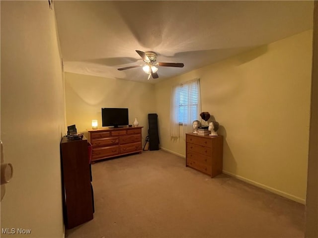 bedroom featuring ceiling fan and light colored carpet