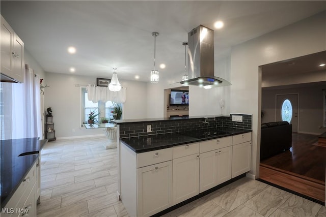 kitchen featuring white cabinetry, backsplash, island exhaust hood, black cooktop, and pendant lighting