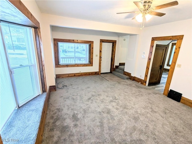 interior space featuring ceiling fan