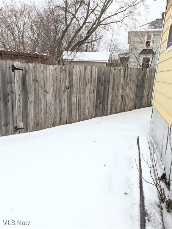 view of yard layered in snow