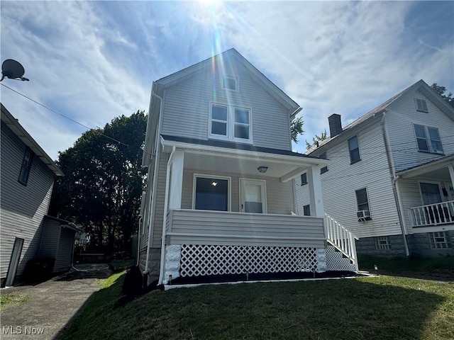 view of front of house featuring a porch and a front lawn