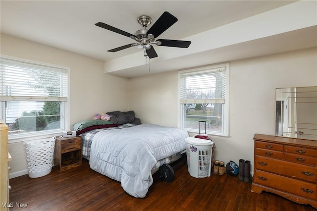 bedroom featuring ceiling fan and dark hardwood / wood-style floors