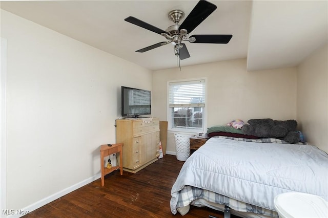 bedroom with ceiling fan and dark hardwood / wood-style flooring