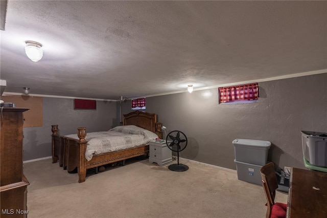 bedroom featuring light carpet and a textured ceiling