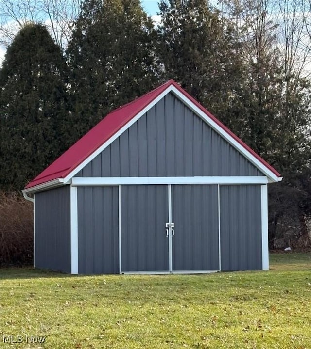 view of outbuilding with a lawn