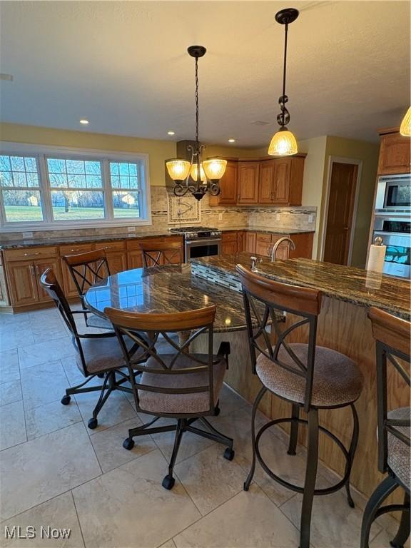 dining room featuring an inviting chandelier and sink