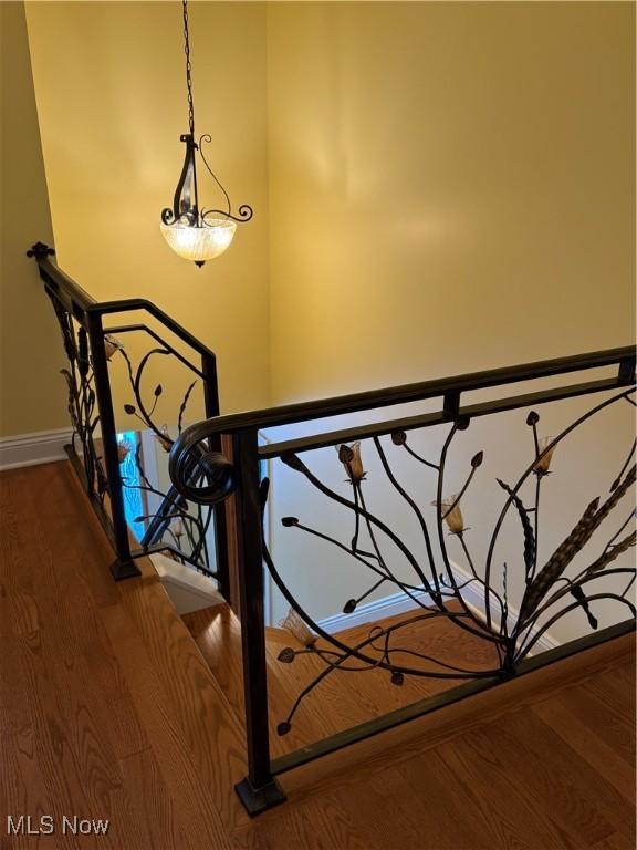 stairway with wood-type flooring