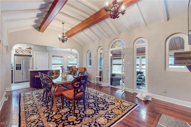 dining area with lofted ceiling with beams, dark hardwood / wood-style floors, a wealth of natural light, and a notable chandelier