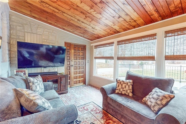 living room with ornamental molding, lofted ceiling, and wood ceiling