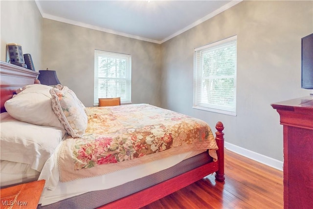 bedroom featuring hardwood / wood-style flooring and ornamental molding