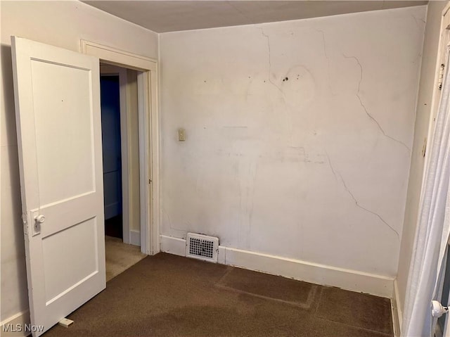 unfurnished room with carpet flooring