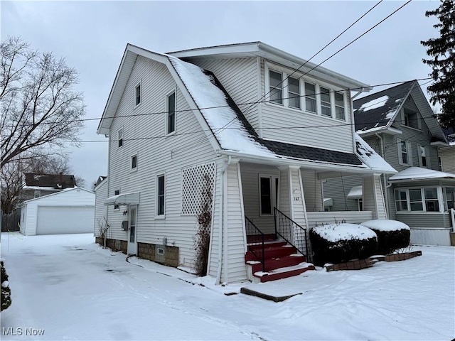 view of front facade with an outbuilding and a garage