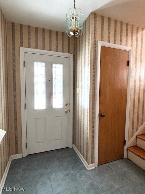 foyer with an inviting chandelier