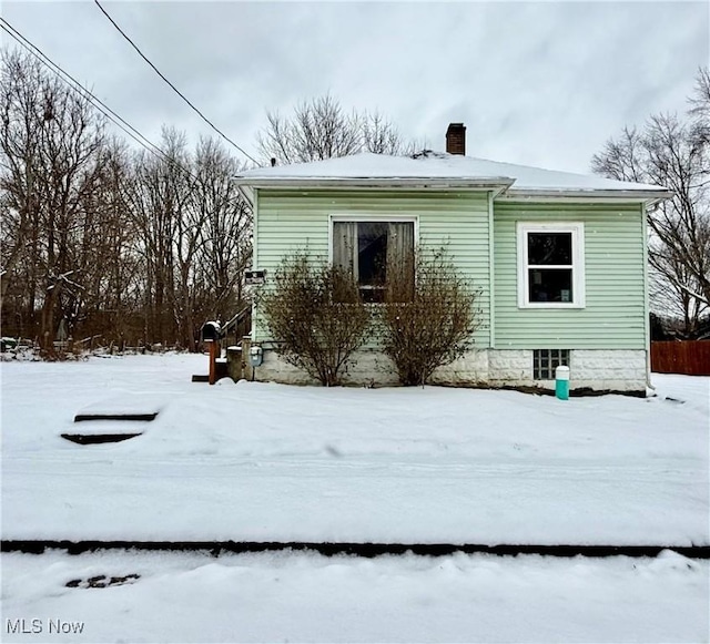 view of snow covered property