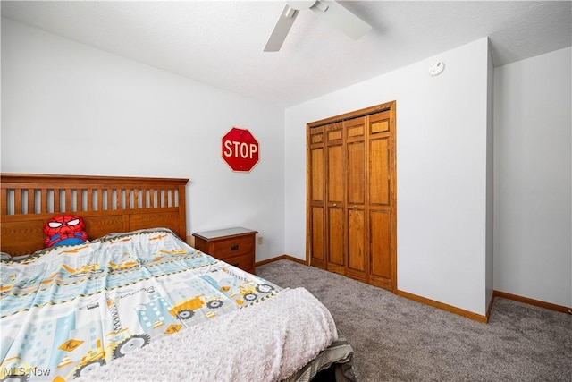 bedroom featuring ceiling fan, a closet, and carpet floors