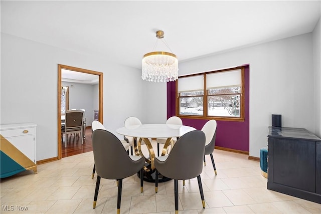 dining space featuring a chandelier