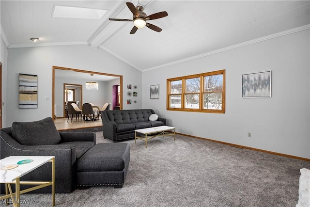 living room featuring ceiling fan, carpet, ornamental molding, and vaulted ceiling with skylight