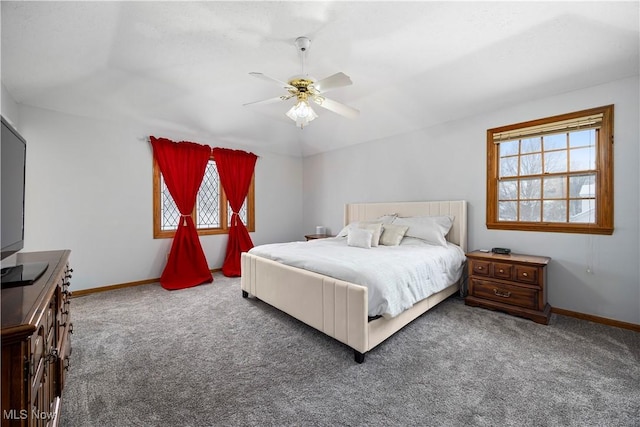 bedroom featuring ceiling fan and dark colored carpet