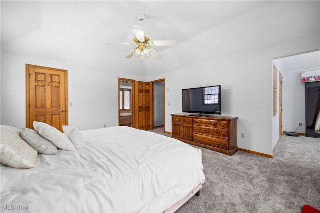 bedroom with ceiling fan, light colored carpet, and lofted ceiling