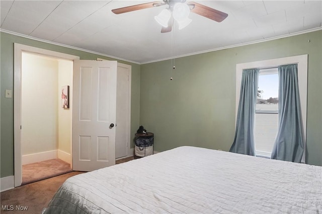 bedroom with carpet flooring, ceiling fan, and ornamental molding