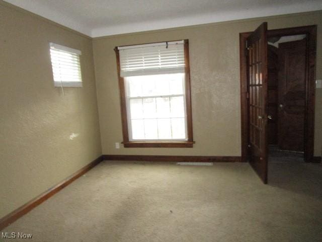 spare room with carpet flooring