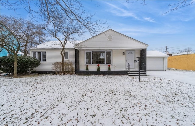 view of front of property with an outbuilding and a garage