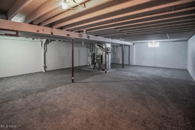 basement with gas water heater and heating unit