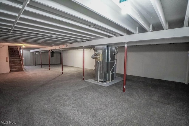 basement featuring heating unit