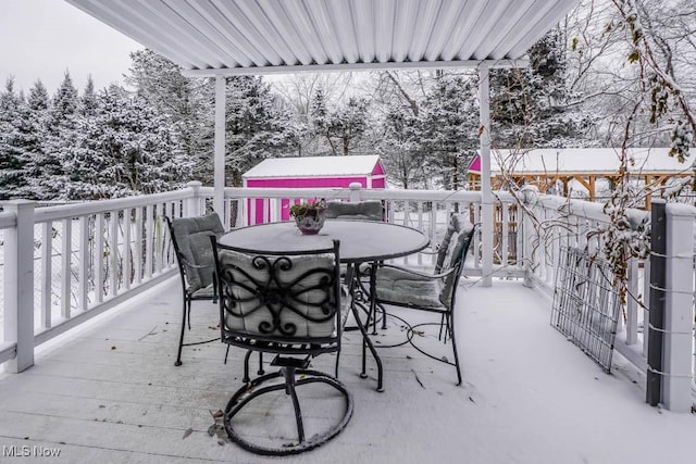 view of snow covered deck